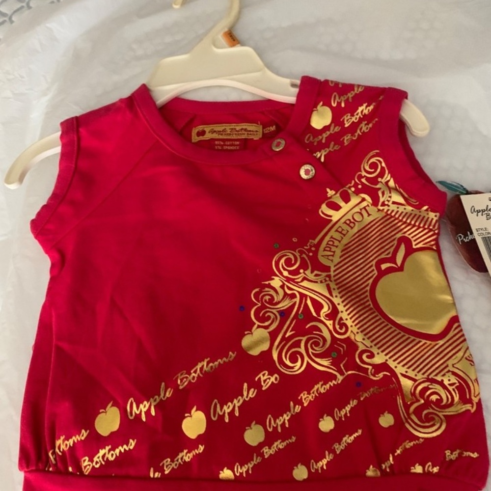 Offering a size 3T little girls top by Appebottoms from their Golden Apple line